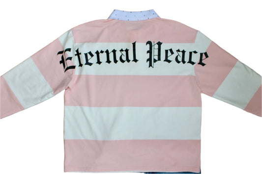 Pink and white striped shirt with 'Eternal Peace' text on a wooden background