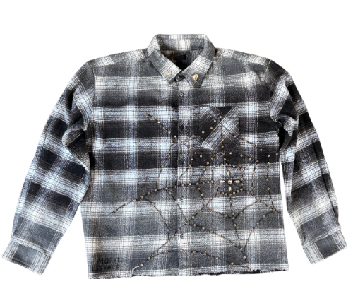 Black and gray plaid shirt with studded details on a white background