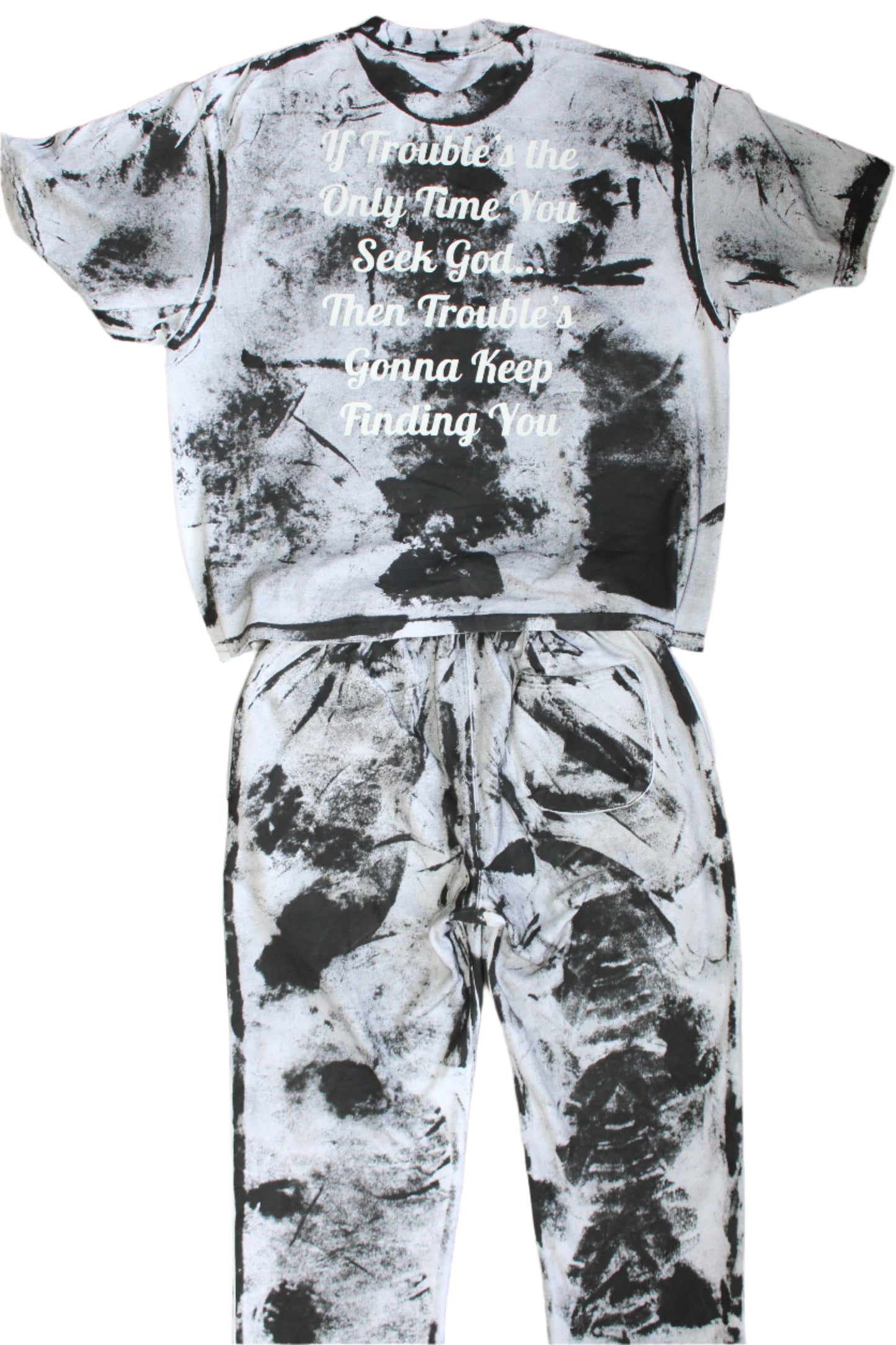 Black and white tie-dye outfit with text on a tiled floor