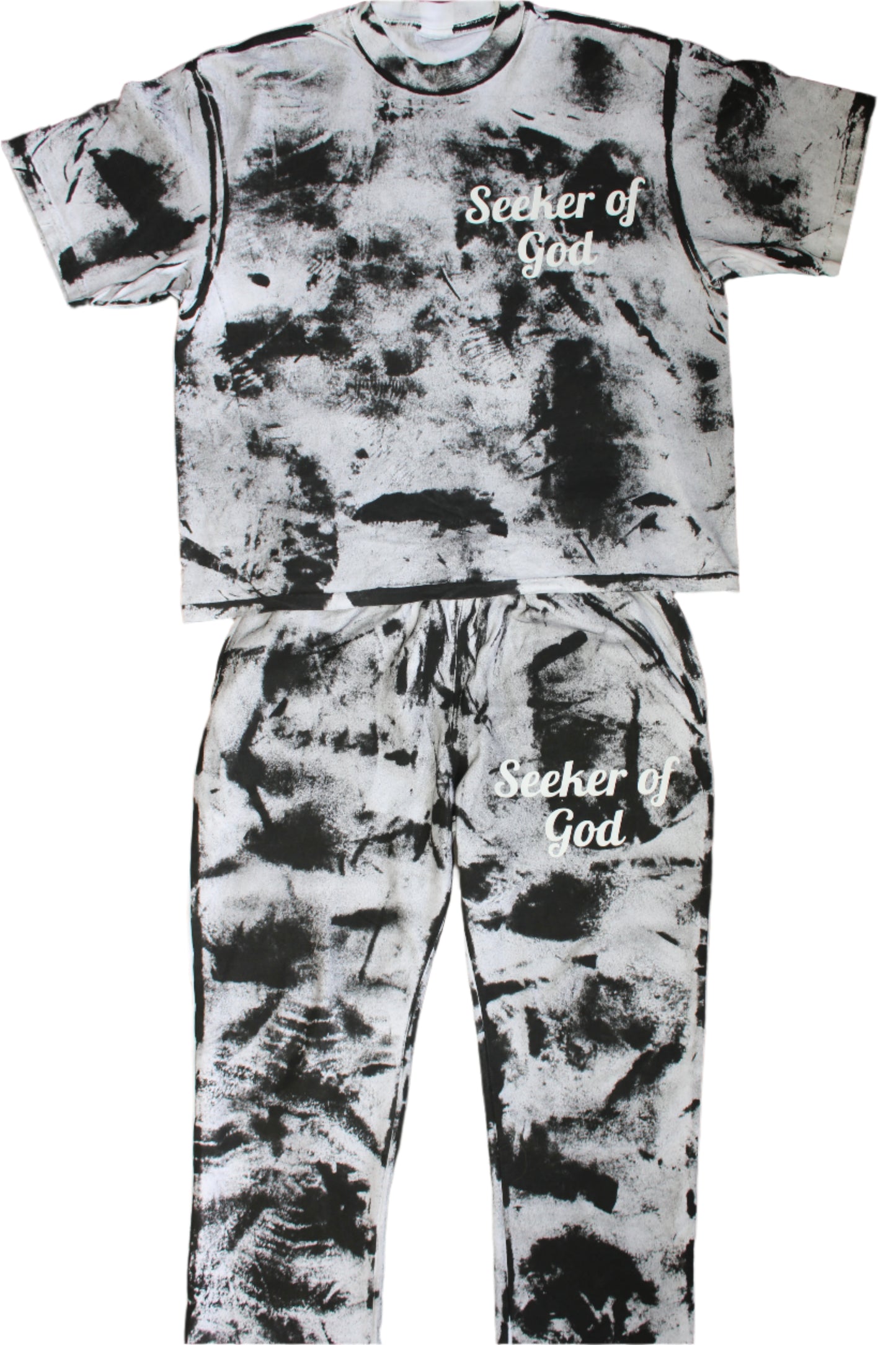 Tie-dye shirt and pants set with 'Seeker of God' text on a wooden floor.