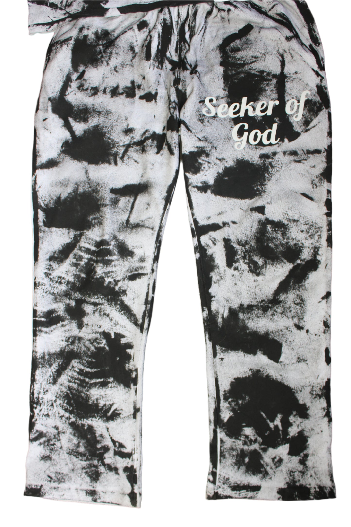 Black and white patterned leggings with text on a wooden floor.