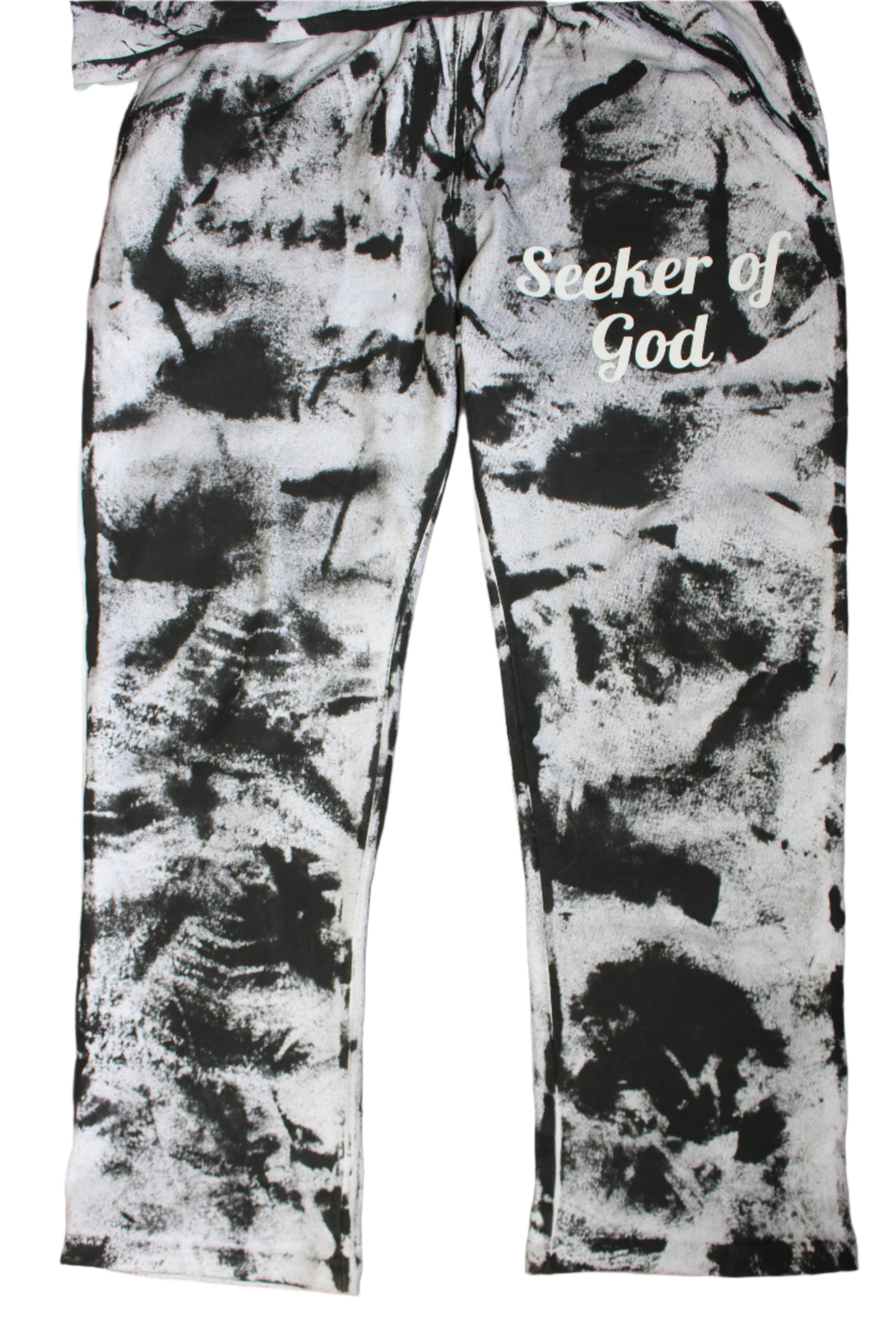 Black and white patterned leggings with text on a wooden floor.