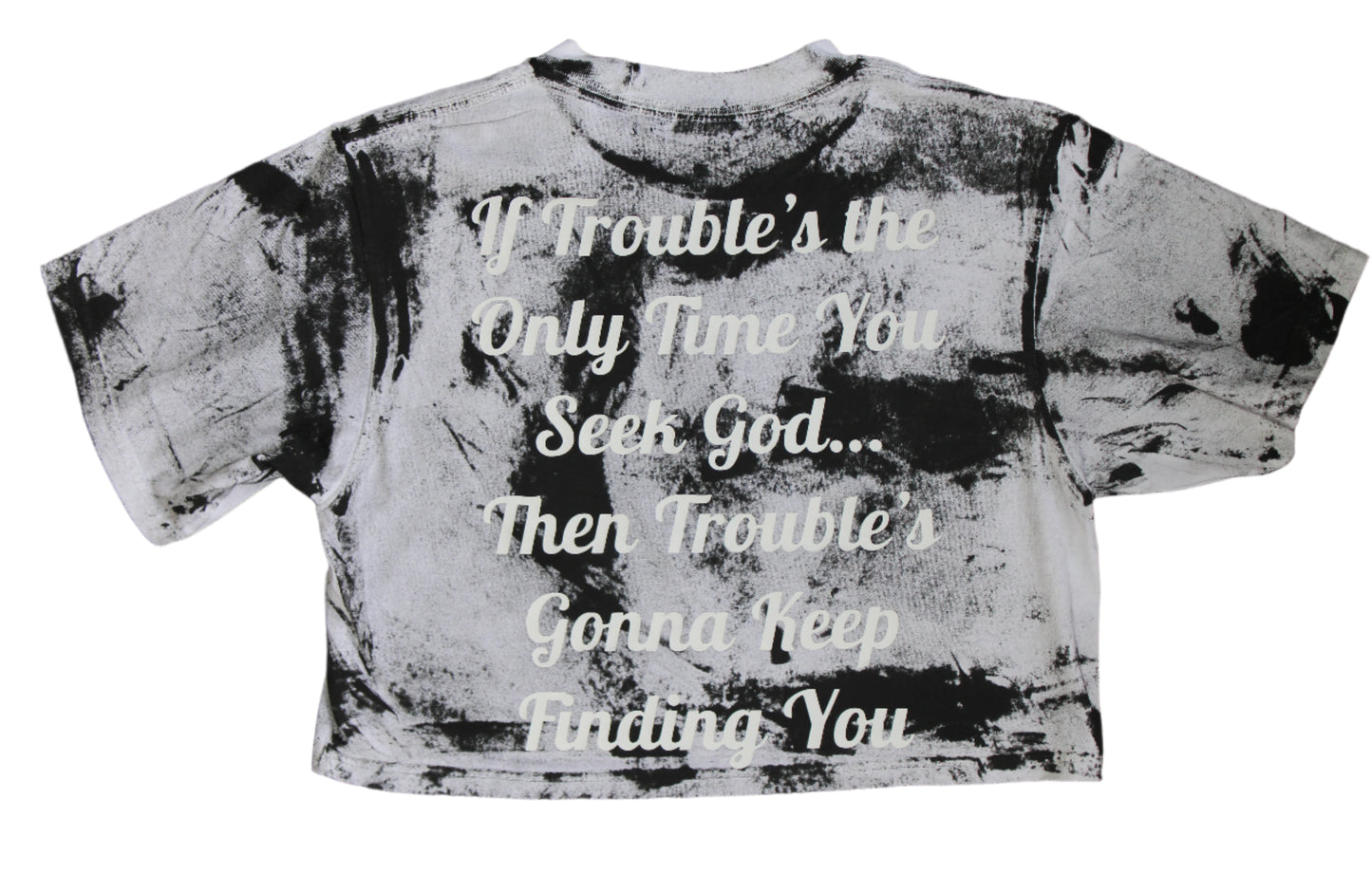 Distressed t-shirt with a motivational quote on a wooden background