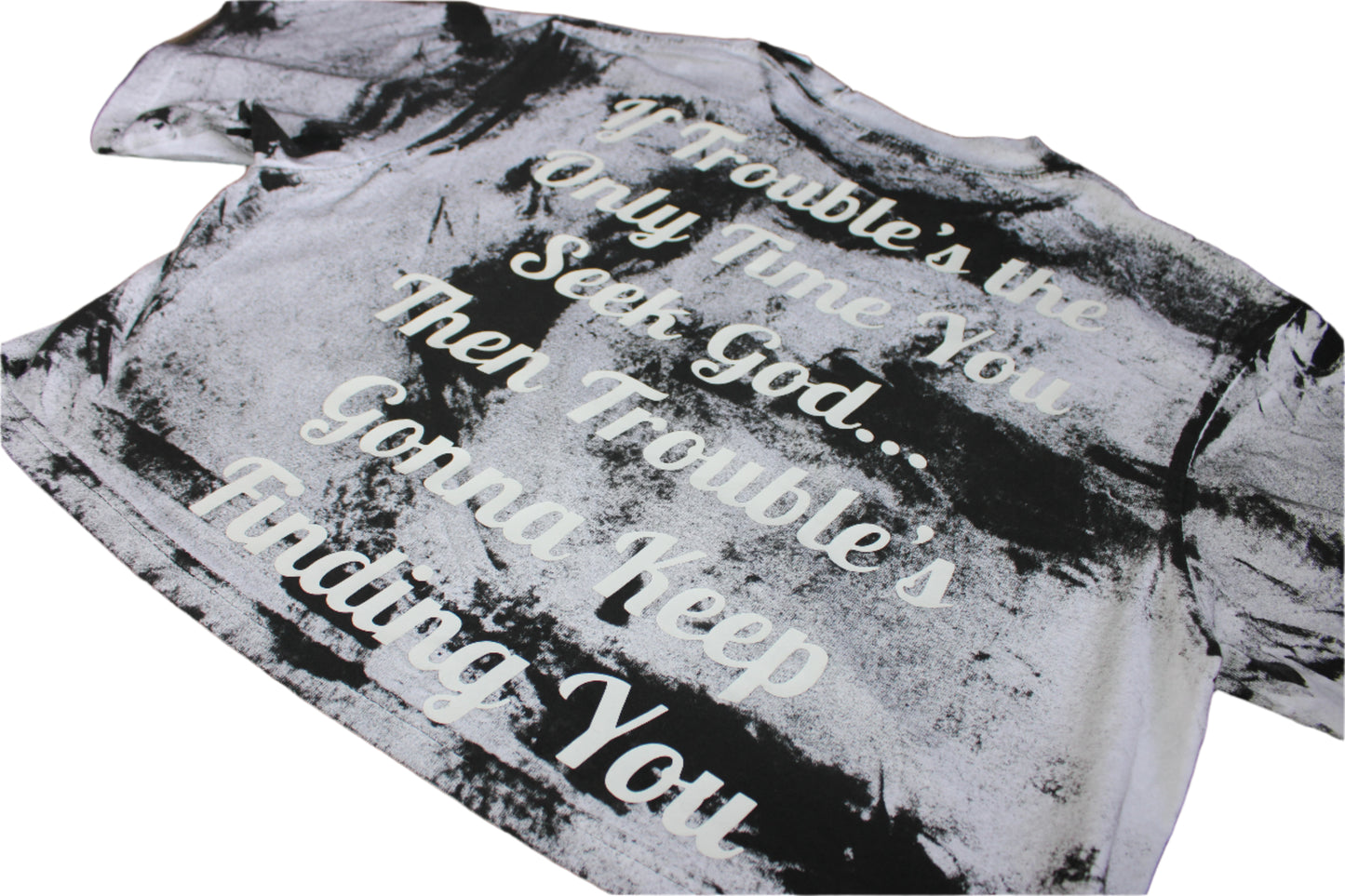 Textured fabric with printed text on a wooden surface